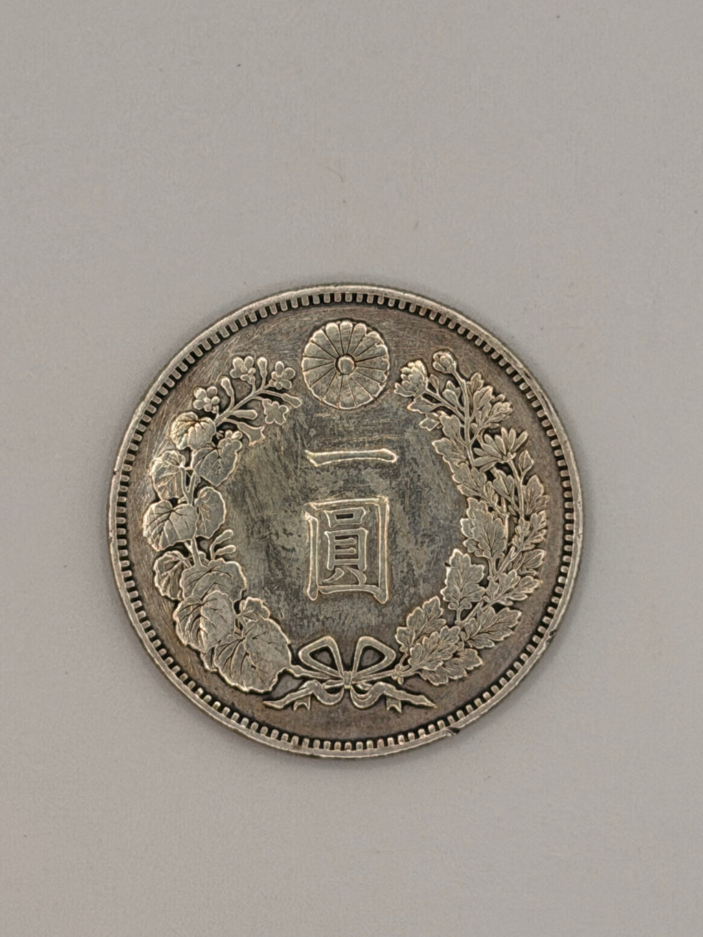 1879 (Year 12) Japan Meiji 1 Yen Silver Coin