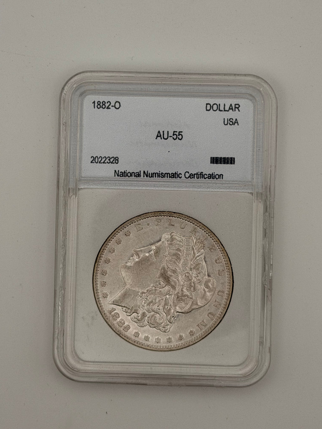 1882-O Morgan Silver Dollar AU55 — NNC Certified
