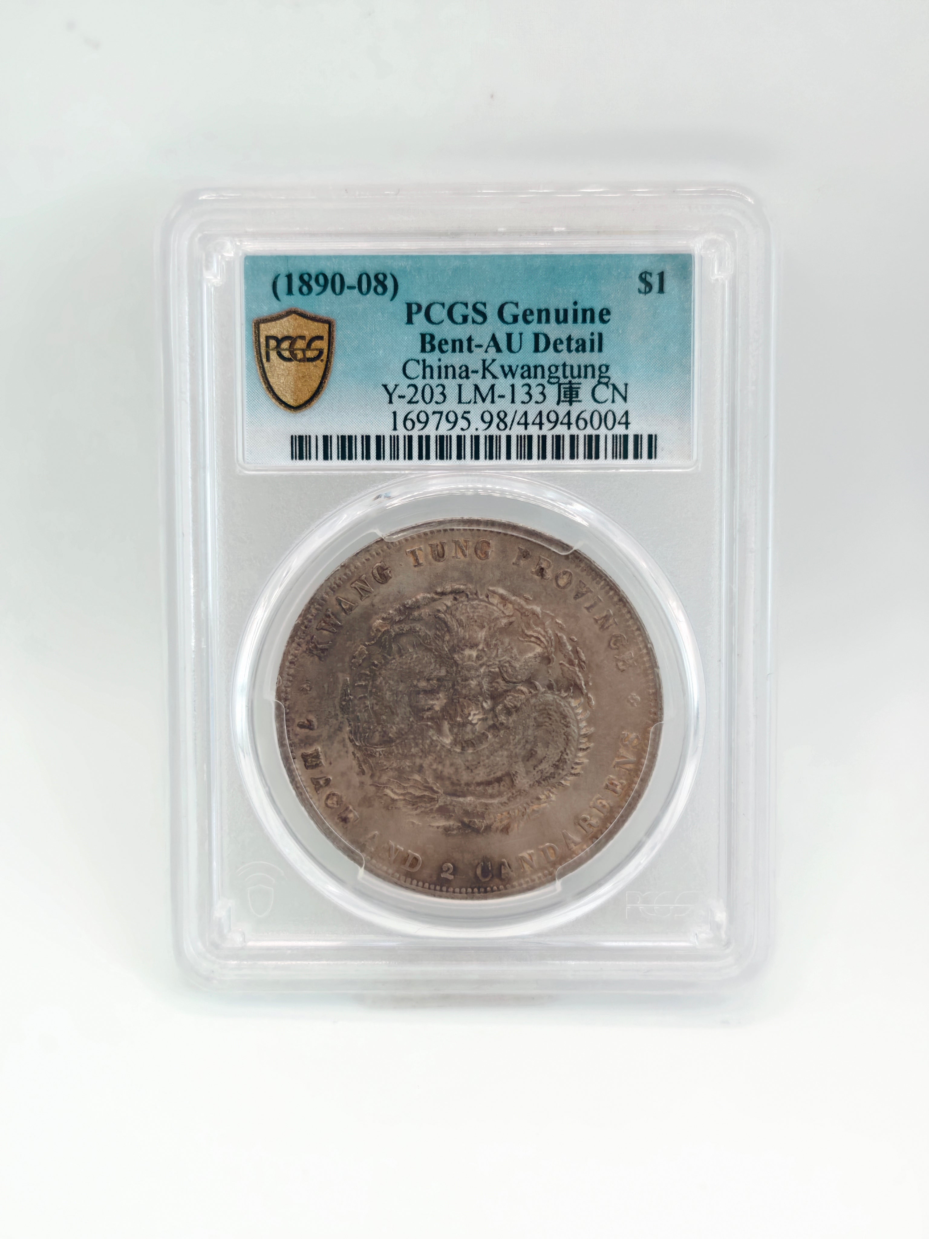 1890-08 - China Kwangtung $1 PCGS Genuine Bent-AU Detail