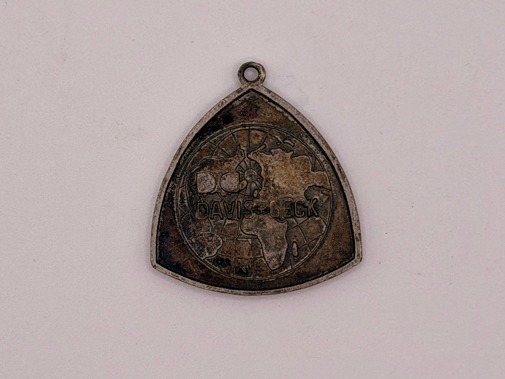 Dexon Davis & Geck Triangular Medallion