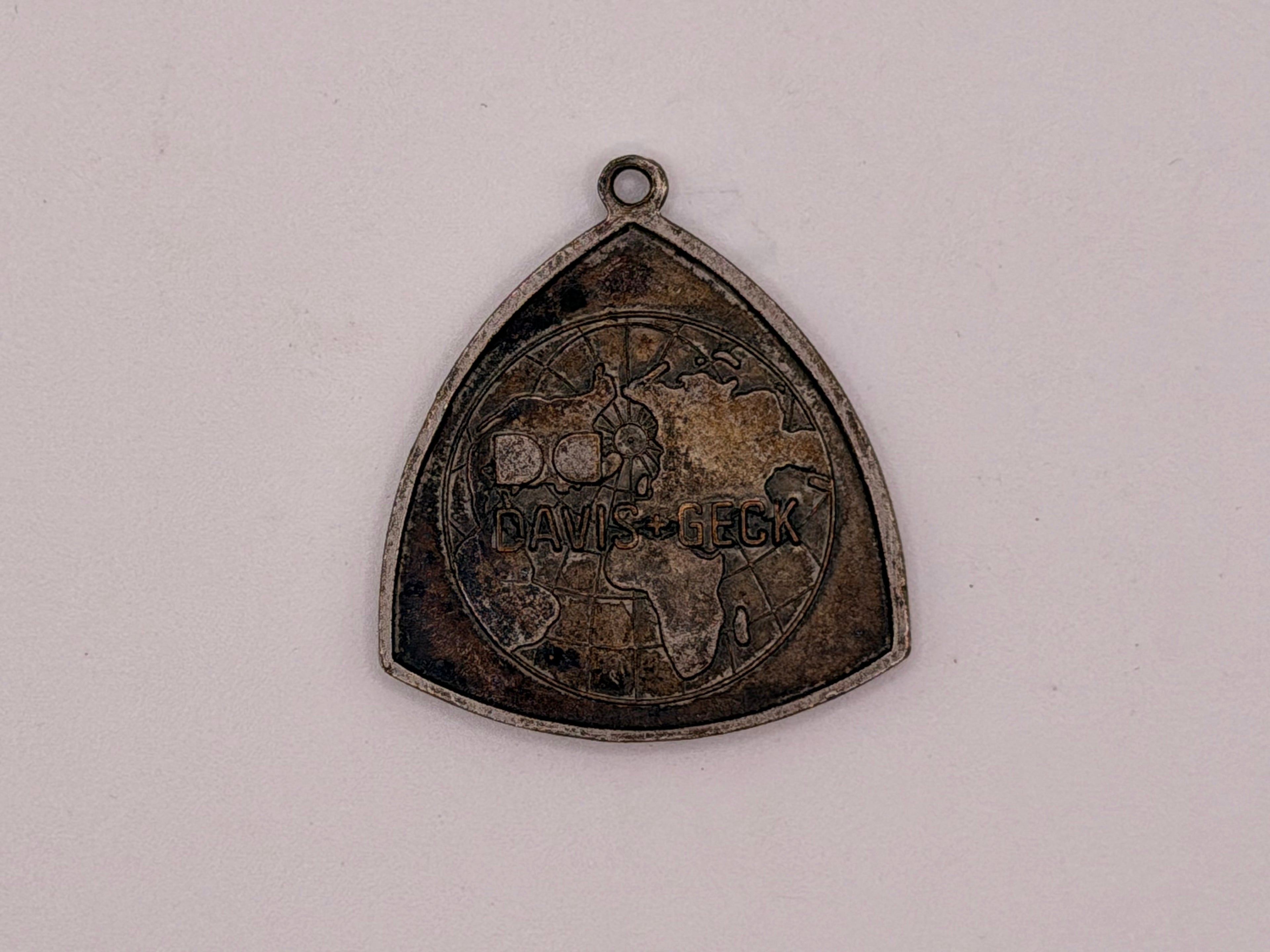 Dexon Davis & Geck Triangular Medallion